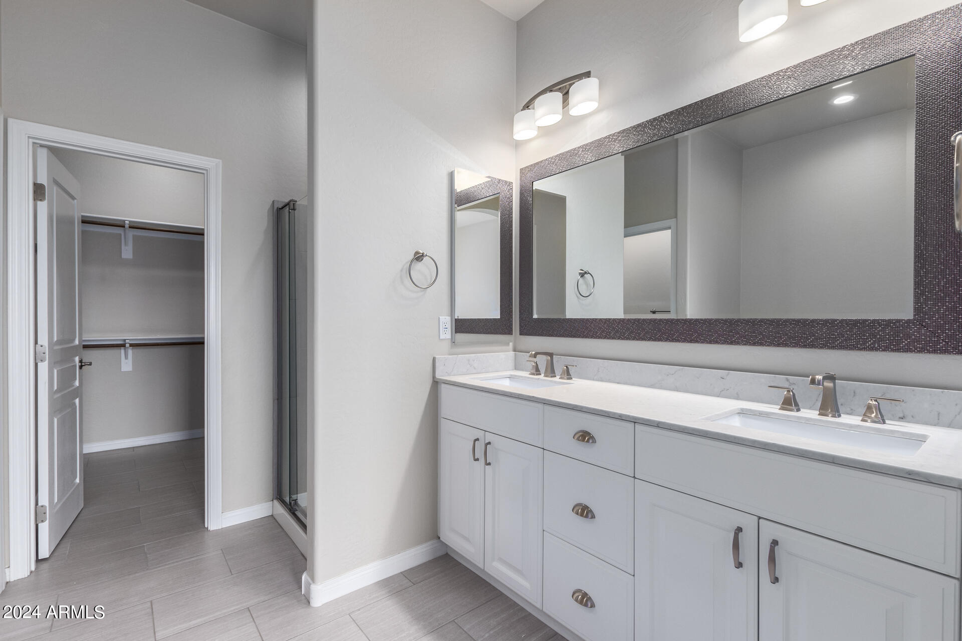 19475 North Grayhawk Drive, Unit 1100 Scottsdale, AZ 85255 - Photo 24 of 54 a bathroom with a double vanity sink and mirror