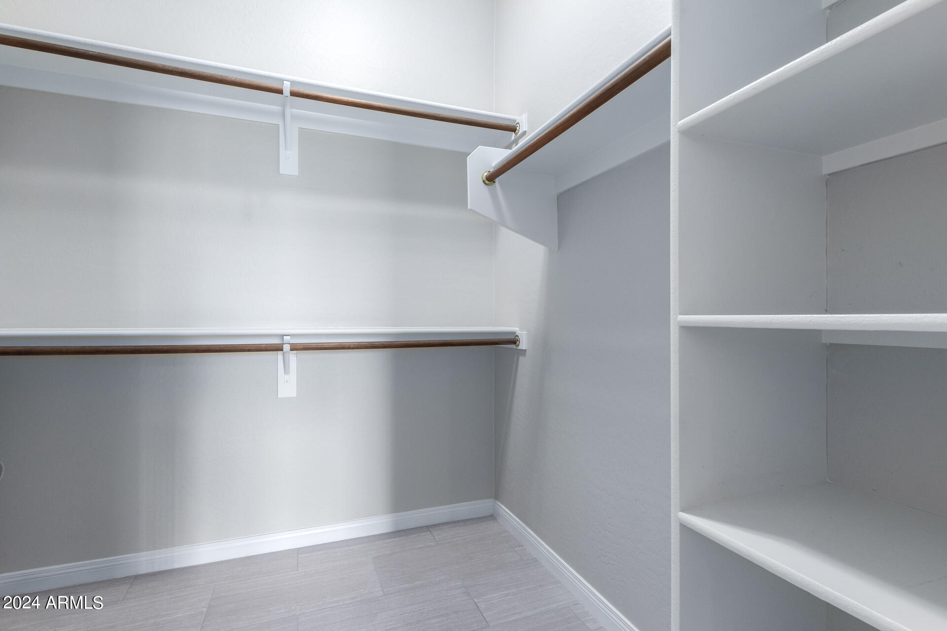 19475 North Grayhawk Drive, Unit 1100 Scottsdale, AZ 85255 - Photo 27 of 54 a view of an empty walk in closet