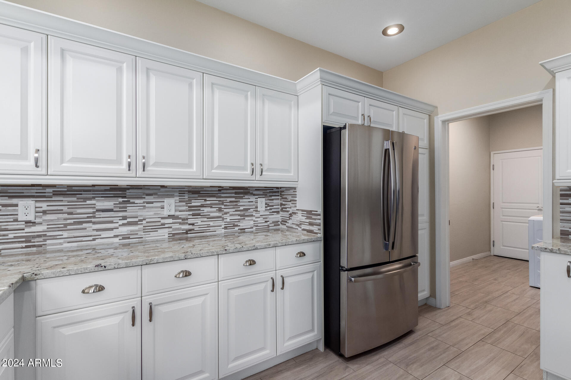 19475 North Grayhawk Drive, Unit 1100 Scottsdale, AZ 85255 - Photo 3 of 54 a kitchen with stainless steel appliances granite countertop a refrigerator sink and cabinets