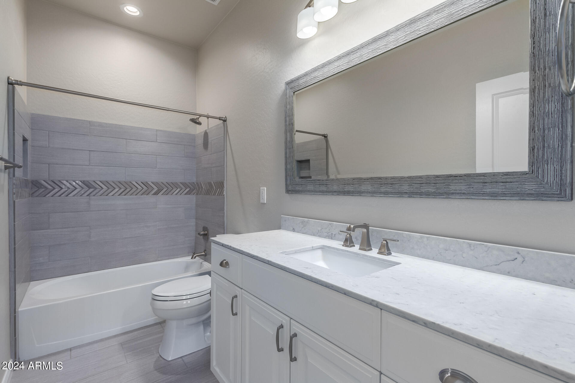 19475 North Grayhawk Drive, Unit 1100 Scottsdale, AZ 85255 - Photo 31 of 54 a bathroom with a sink a toilet and shower