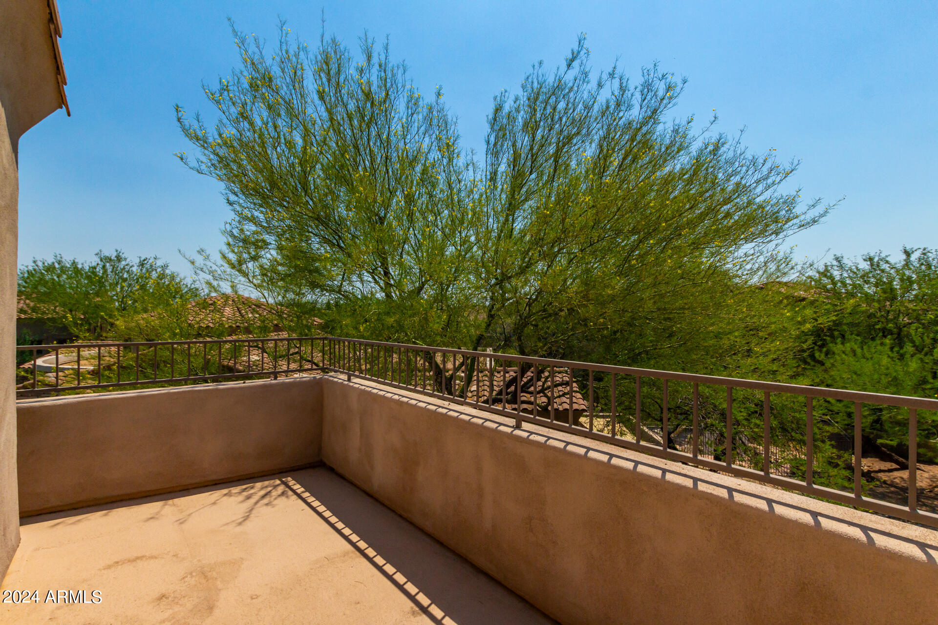 19475 North Grayhawk Drive, Unit 1100 Scottsdale, AZ 85255 - Photo 36 of 54 a view of a balcony with trees