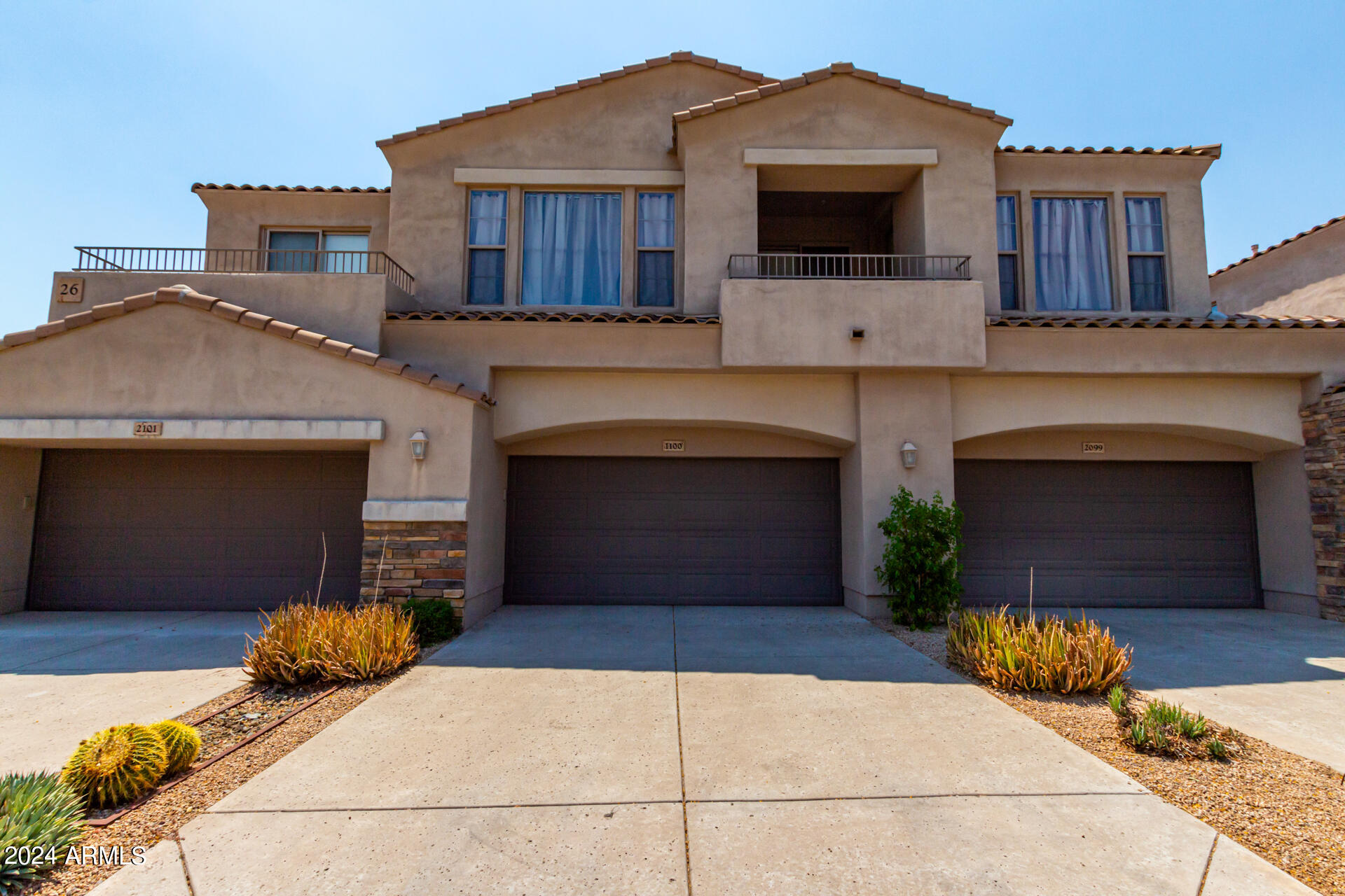 19475 North Grayhawk Drive, Unit 1100 Scottsdale, AZ 85255 - Photo 38 of 54 a front view of a house with yard