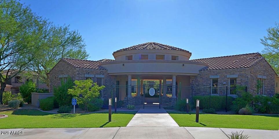 19475 North Grayhawk Drive, Unit 1100 Scottsdale, AZ 85255 - Photo 43 of 54 a front view of a house with a yard