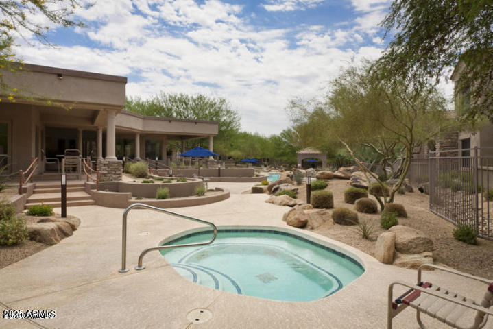 19475 North Grayhawk Drive, Unit 1100 Scottsdale, AZ 85255 - Photo 45 of 54 a view of a swimming pool with outdoor seating