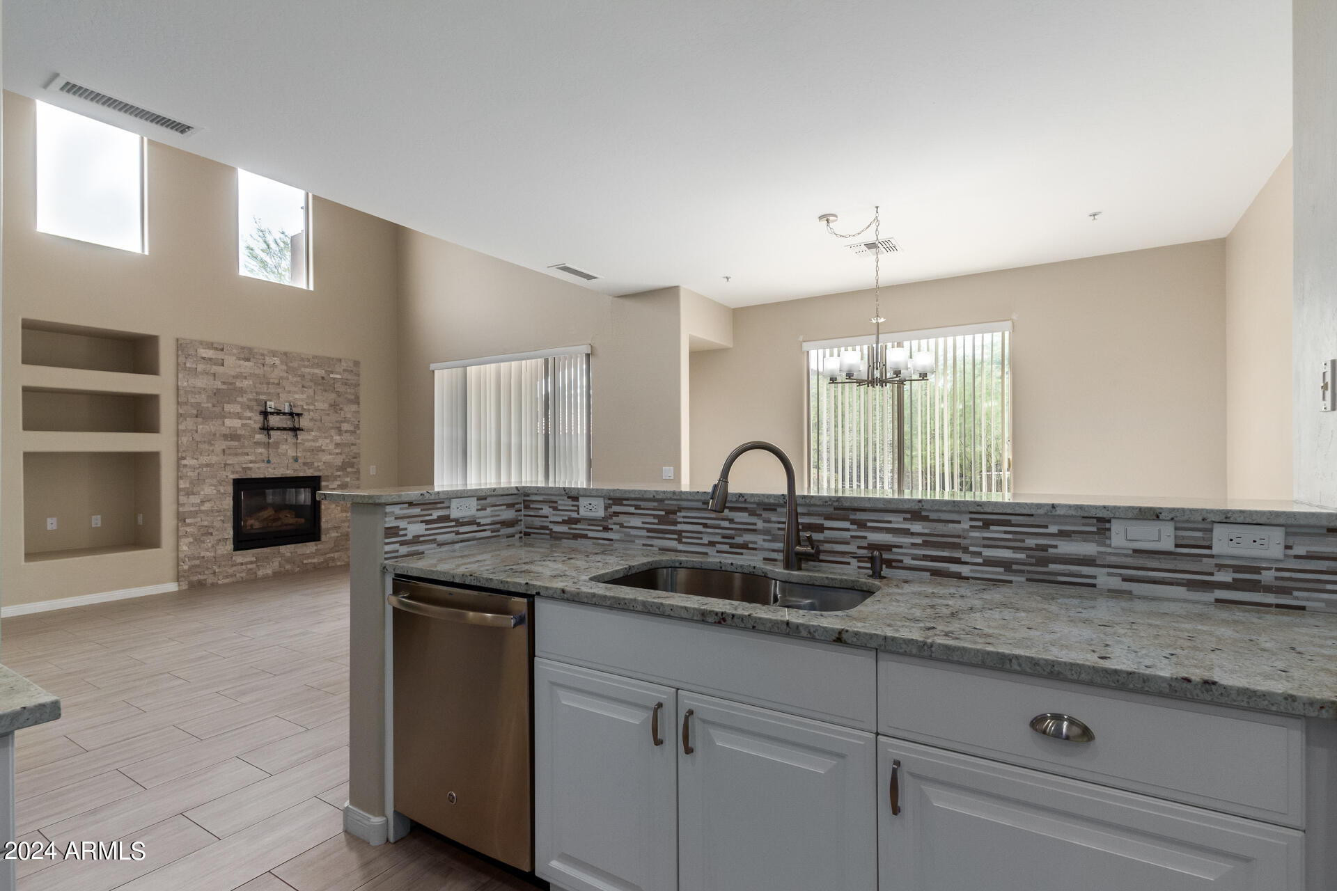 19475 North Grayhawk Drive, Unit 1100 Scottsdale, AZ 85255 - Photo 5 of 54 a kitchen with cabinets appliances and a counter space