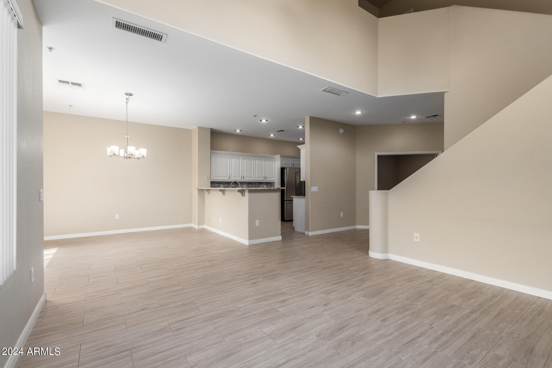 19475 North Grayhawk Drive, Unit 1100 Scottsdale, AZ 85255 - Photo 9 of 54 a view of kitchen with refrigerator microwave and wooden floor