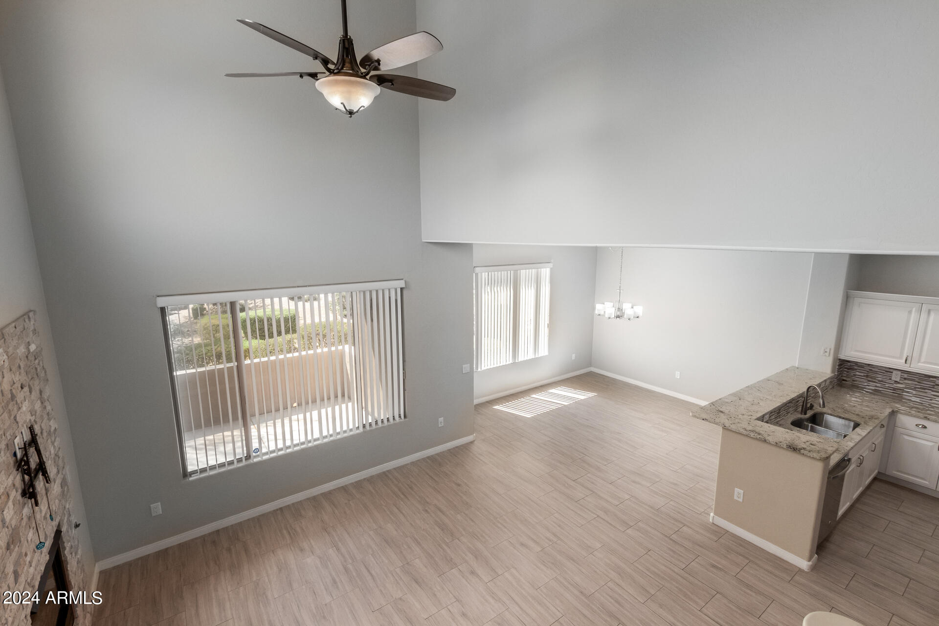 19475 North Grayhawk Drive, Unit 1100 Scottsdale, AZ 85255 - Photo 10 of 54 a view of livingroom with hardwood floor and a ceiling fan