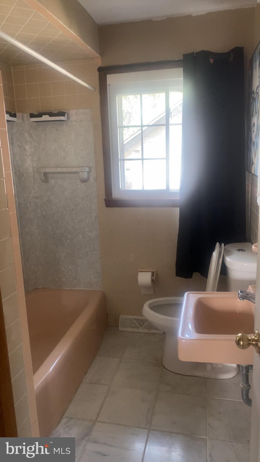 307 Burlington Avenue Delanco, NJ 08075 - Photo 4 of 6 a bathroom with a toilet and a shower