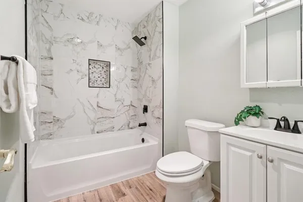 a bathroom with a sink toilet and bathtub
