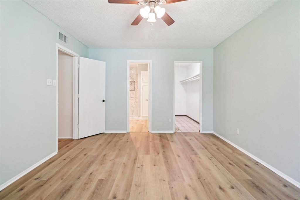 3216 Red Oak Lane Bedford, TX 76021 - Photo 33 of 40 wooden floor in an empty room with a window