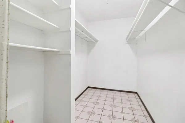 a view of an empty walk in closet