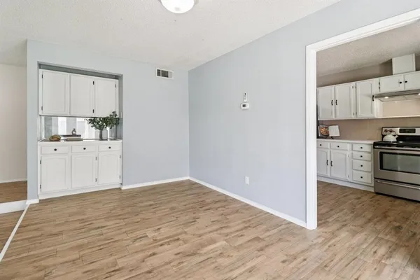 a view of kitchen with wooden floor