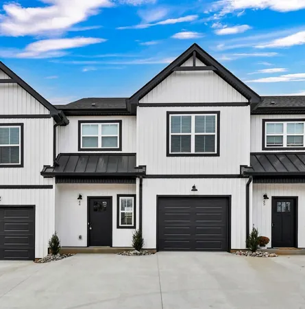 a front view of a house with garage