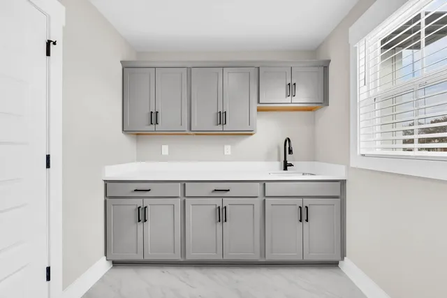 a view with cabinets a sink and dishwasher
