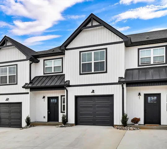 a front view of a house with a garage