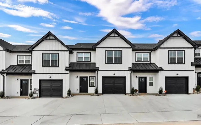 a front view of a house with yard