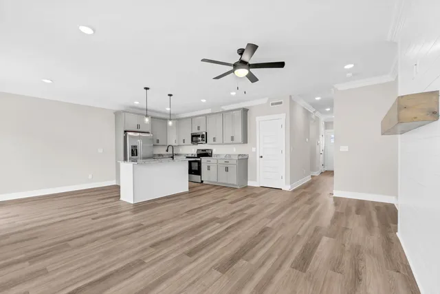 a view of kitchen with wooden floor and window
