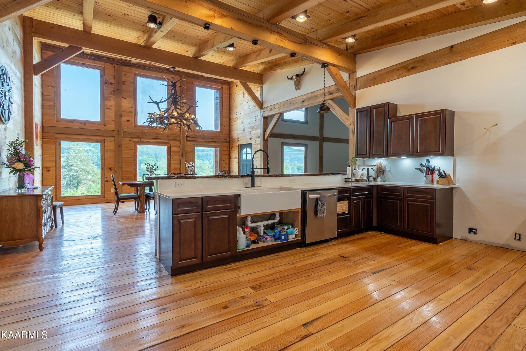 1391 Dutch Valley Road Clinton, TN 37716 - Photo 11 of 44 a kitchen with stainless steel appliances wooden floors and view living room