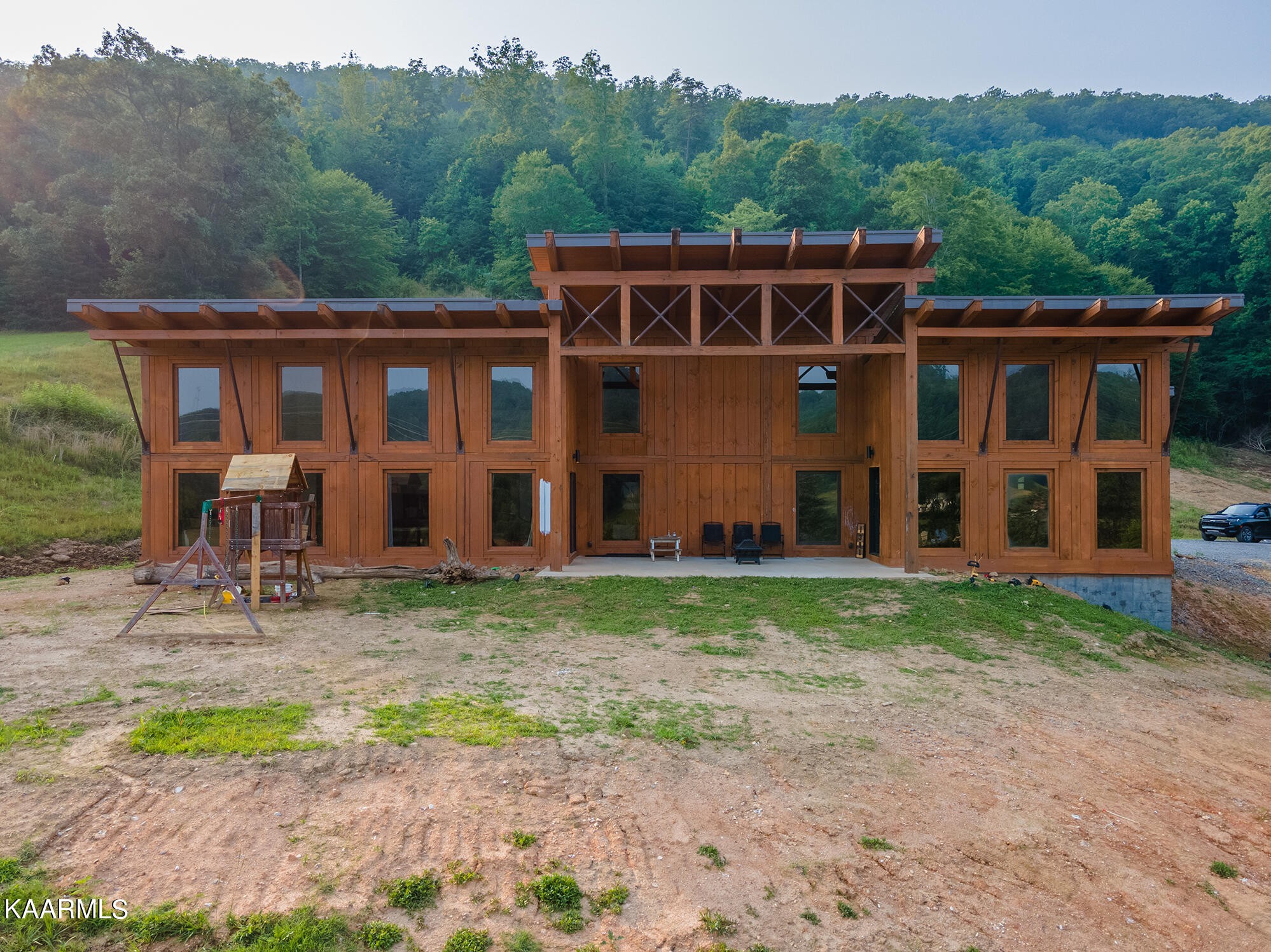 1391 Dutch Valley Road Clinton, TN 37716 - Photo 4 of 44 a front view of house with deck and yard