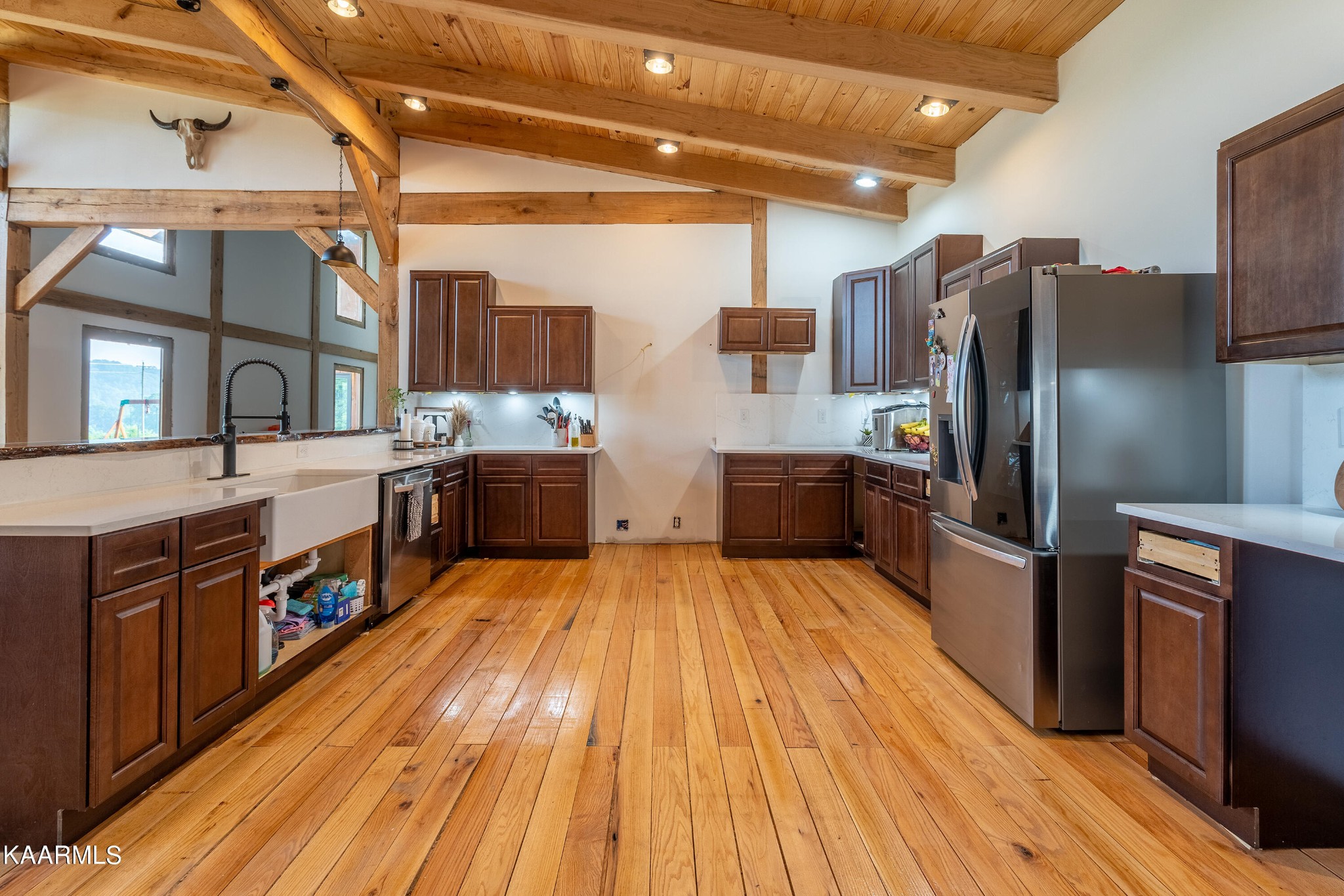 1391 Dutch Valley Road Clinton, TN 37716 - Photo 10 of 44 a large kitchen with stainless steel appliances wooden floors and wooden cabinets