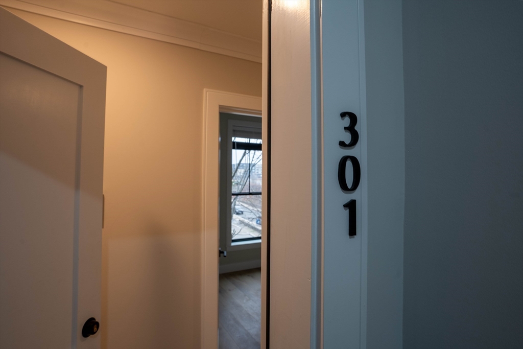 157 Everett Street, Unit 301 Boston, MA 02134 - Photo 9 of 9 a view of a bathroom from a hallway