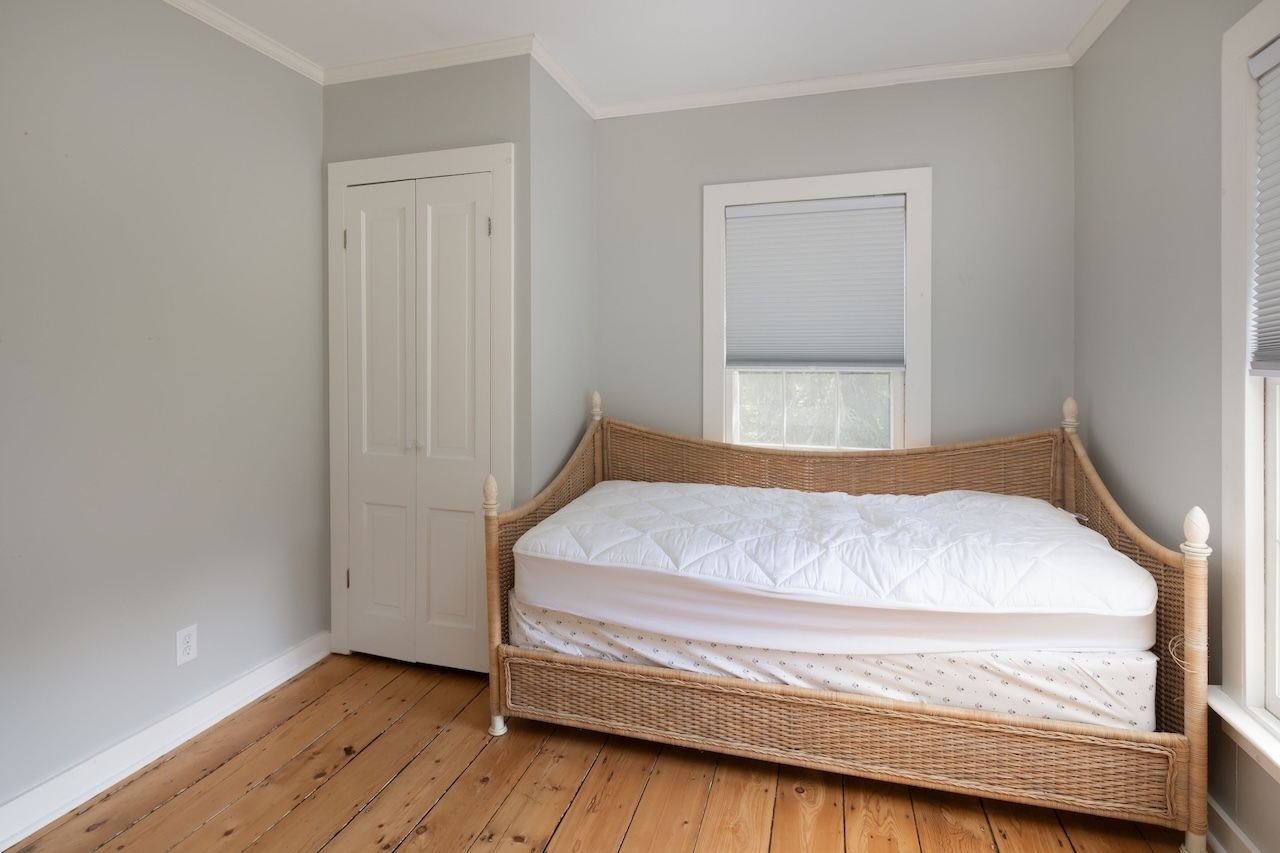 14 Library Street, Unit A Salisbury, CT 06068 - Photo 13 of 14 a bedroom with a bed and a window