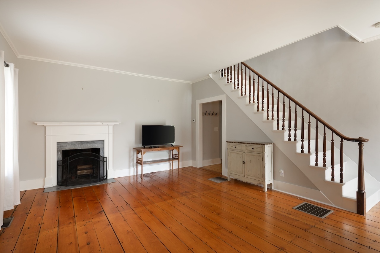 14 Library Street, Unit A Salisbury, CT 06068 - Photo 2 of 14 a view of a livingroom with wooden floor and a fireplace