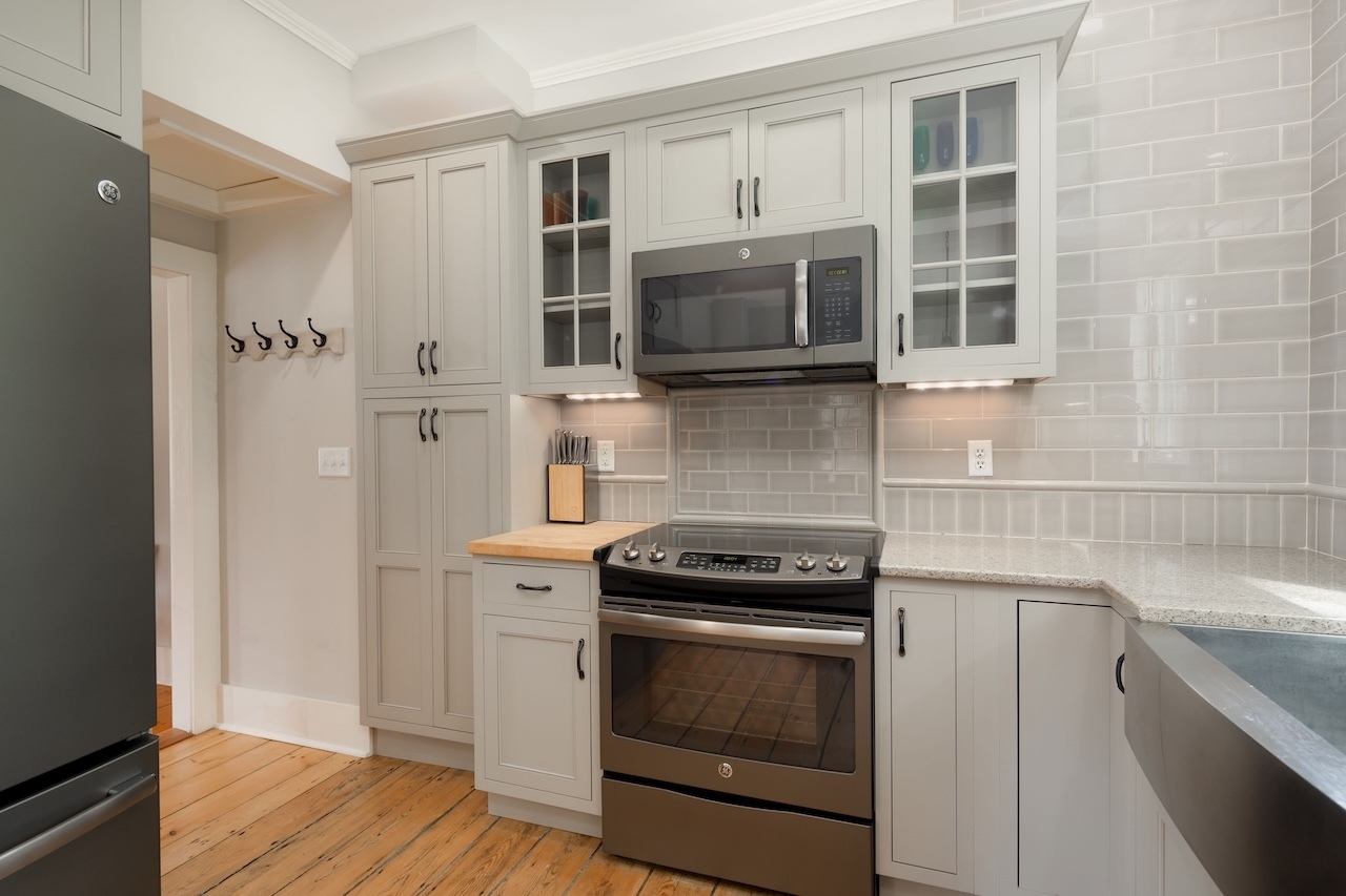 14 Library Street, Unit A Salisbury, CT 06068 - Photo 6 of 14 a kitchen with cabinets stainless steel appliances and wooden floor