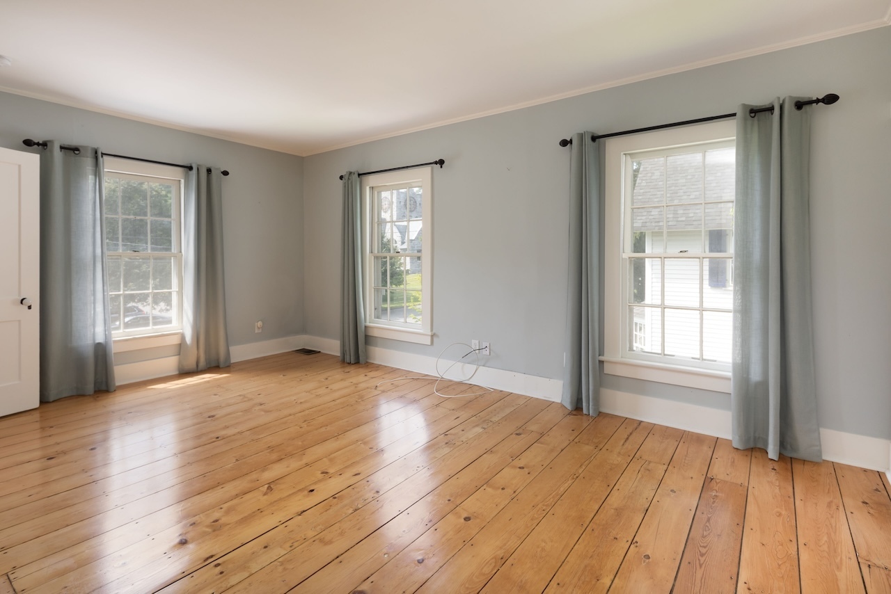 14 Library Street, Unit A Salisbury, CT 06068 - Photo 9 of 14 a view of an empty room with wooden floor and a window