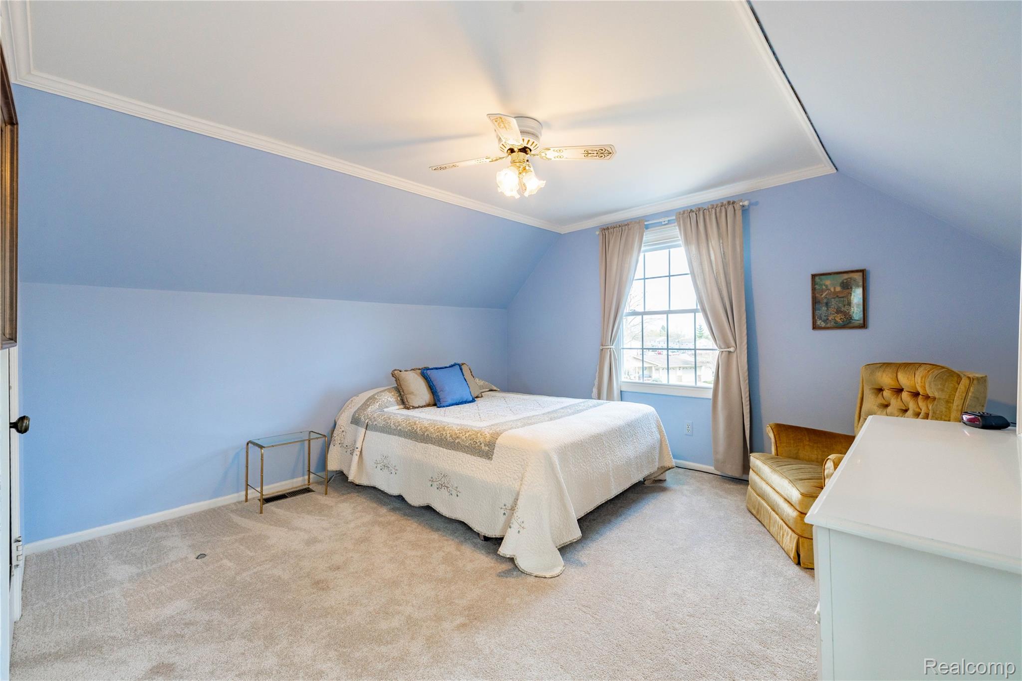 27758 Johnson Road Grosse Ile, MI 48138 - Photo 29 of 49 Bedroom with light colored carpet, vaulted ceiling, ceiling fan, and ornamental molding