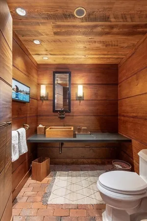a bathroom with a toilet and a sink