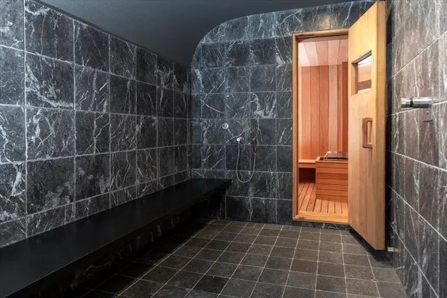 a bathroom with a glass door shower