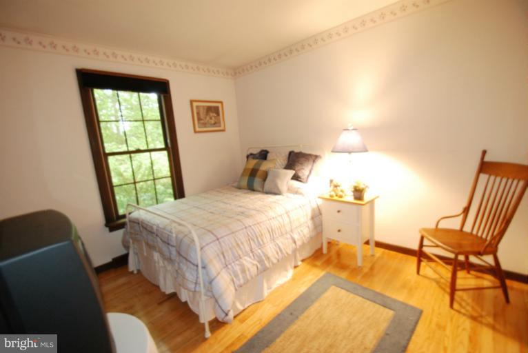 14123 Sunnybrook Road Phoenix, MD 21131 - Photo 15 of 30 a bedroom with a bed and a window