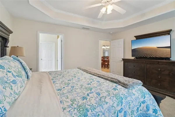 a spacious bathroom with a granite countertop sink a mirror and a shower