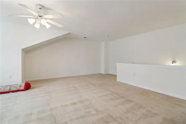 a view of a livingroom with a chandelier fan