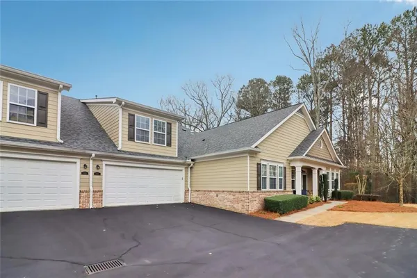 a front view of a house with a garage
