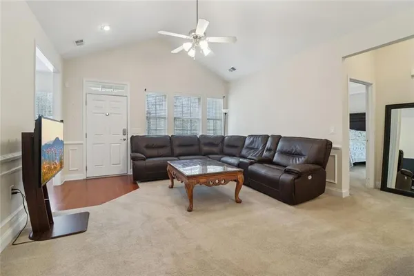 a living room with furniture and a window