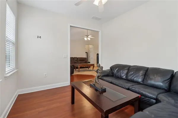 a living room with furniture and a window