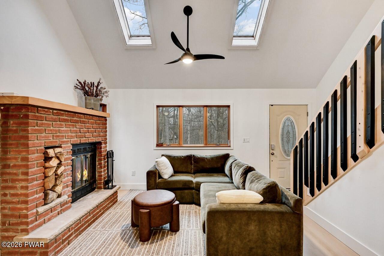 258 Lakeview Road Lackawaxen, PA 18435 - Photo 14 of 119 a living room with furniture and a large window
