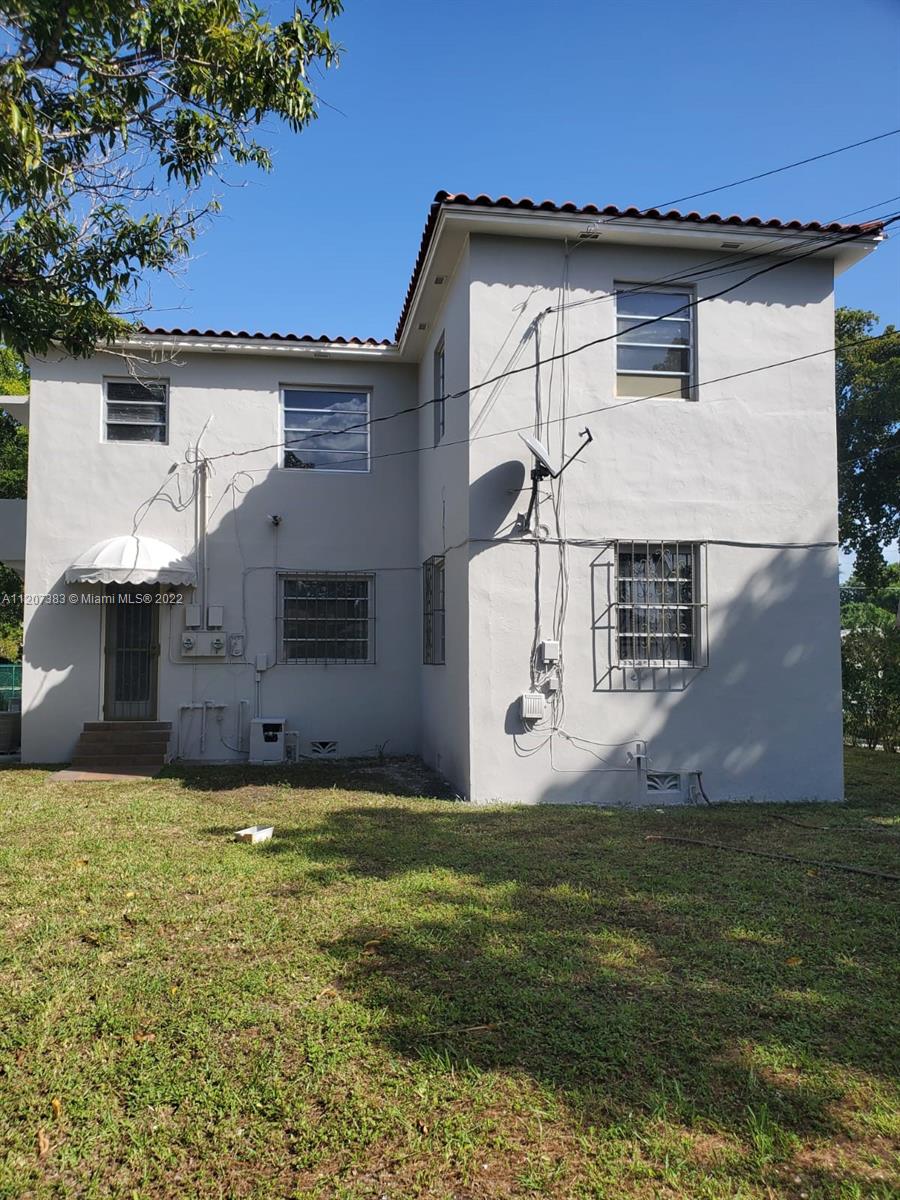 1254 Southwest 13th Avenue Miami, FL 33135 - Photo 3 of 7 a view of a house with a yard