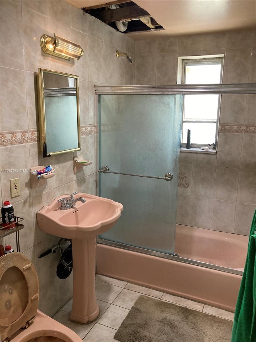 1254 Southwest 13th Avenue Miami, FL 33135 - Photo 7 of 7 a bathroom with a sink toilet and shower