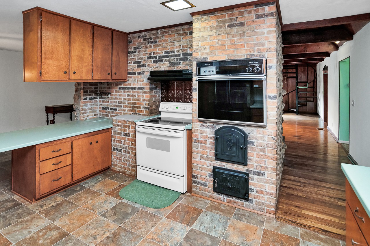 253 Hunter Road Fayetteville, TN 37334 - Photo 18 of 61 a kitchen with stainless steel appliances granite countertop a stove top oven a sink and a microwave