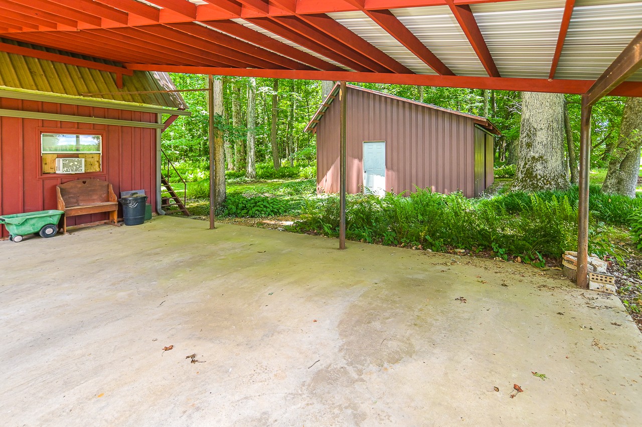 253 Hunter Road Fayetteville, TN 37334 - Photo 42 of 61 a view of a backyard with plants and a patio