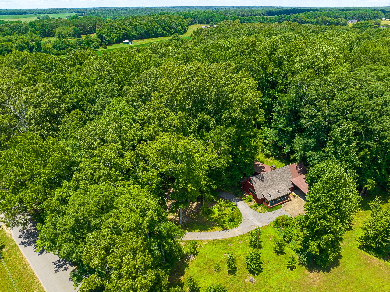 253 Hunter Road Fayetteville, TN 37334 - Photo 53 of 61 a view of a wooden house with a yard