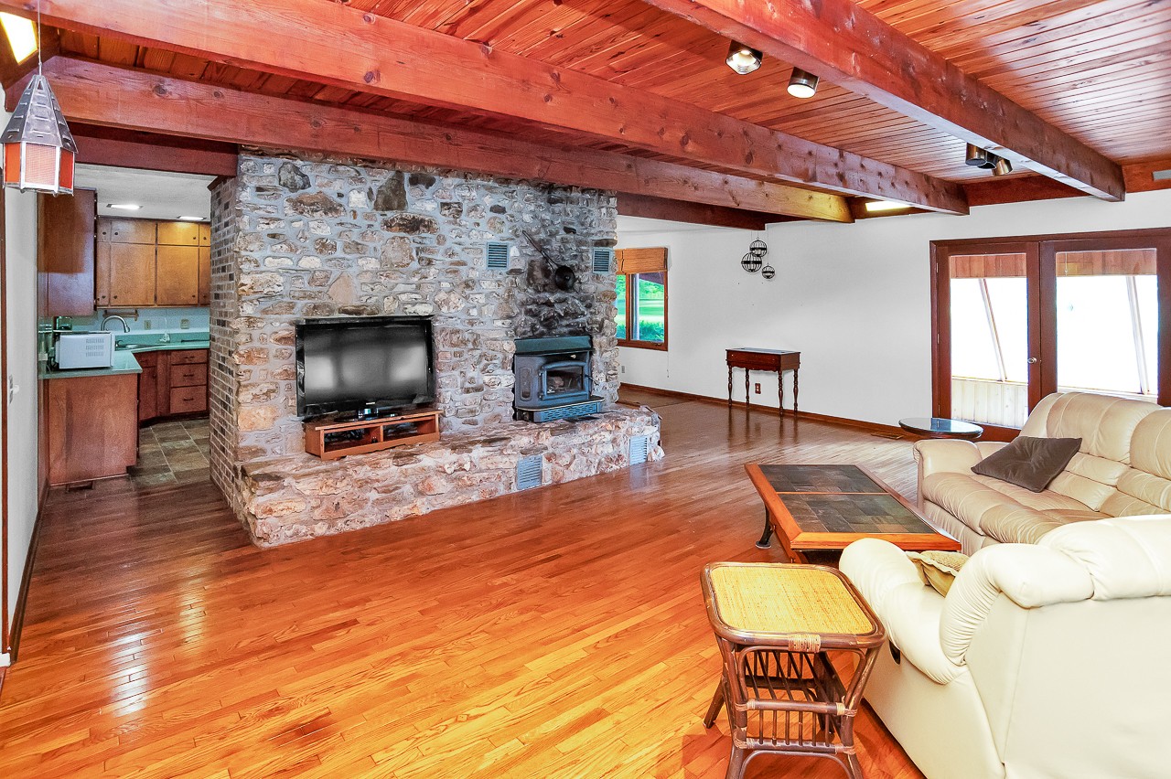 253 Hunter Road Fayetteville, TN 37334 - Photo 10 of 61 a living room with furniture a flat screen tv and a fireplace