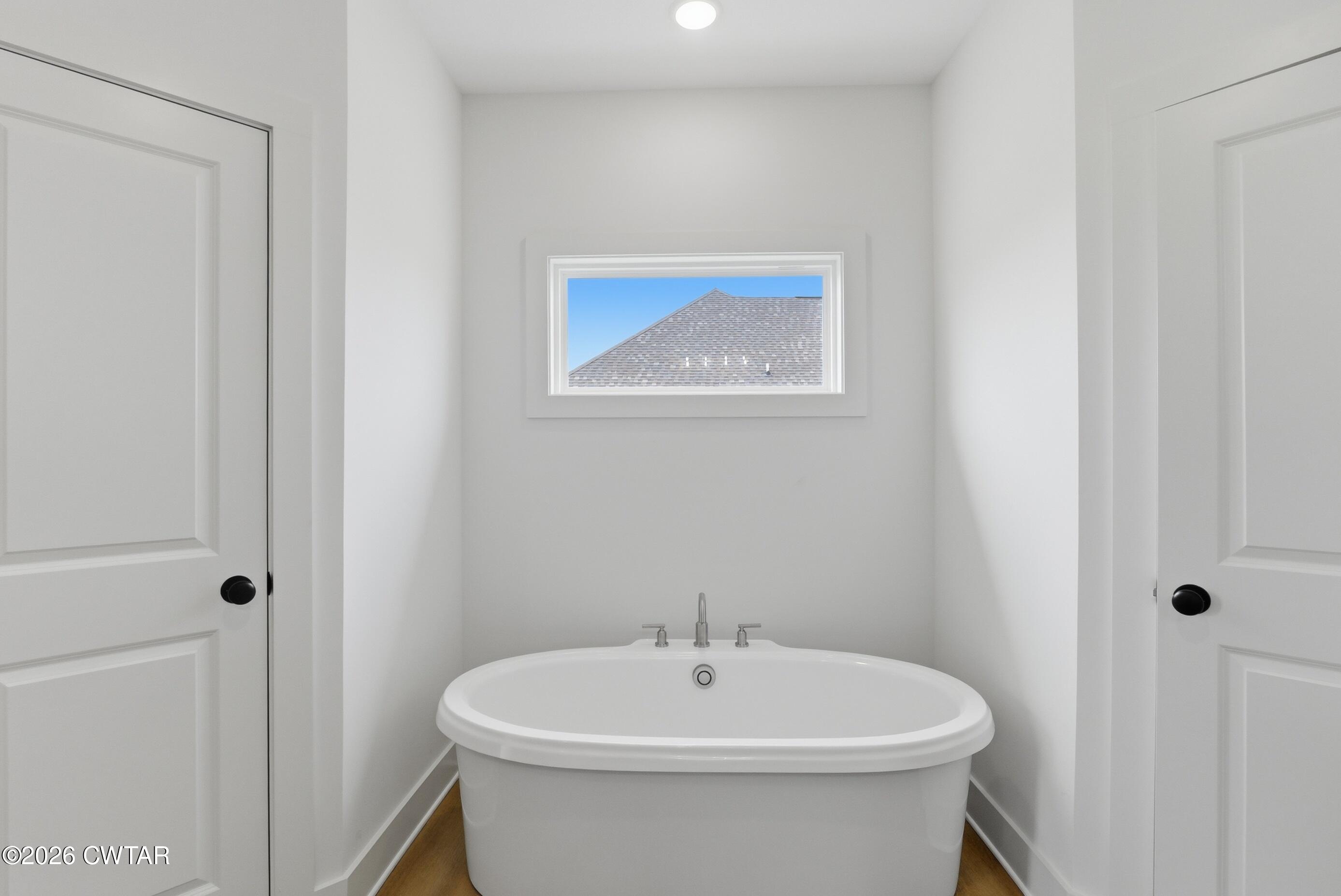 179 Daybreak Loop Medina, TN 38355 - Photo 17 of 32 a white bath tub sitting next to a white toilet