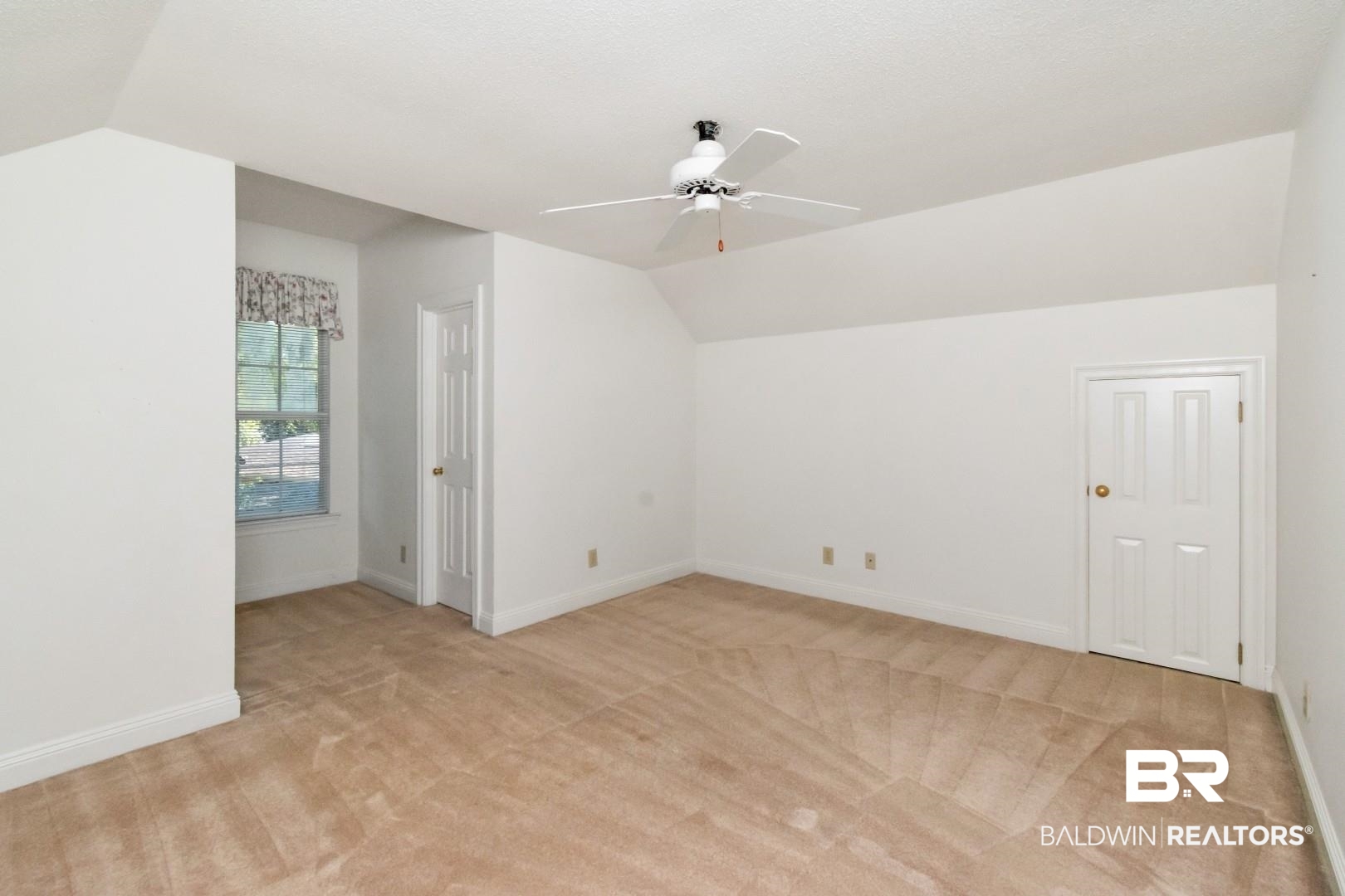 105 McHugh Lane Mobile, AL 36608 - Photo 20 of 30 Additional living space featuring lofted ceiling, light carpet, and a ceiling fan