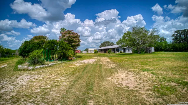 a view of a golf course with a lake