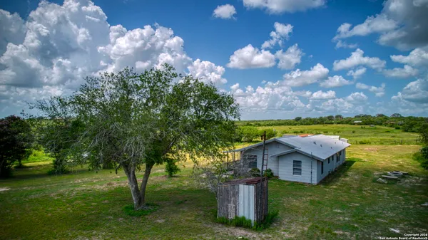 a view of a house with a big yard