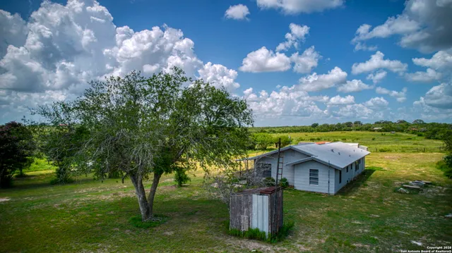 a view of a house with a big yard